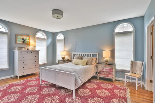 a bedroom with a bed and dresser