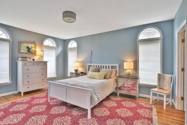 a bedroom with a bed and dresser