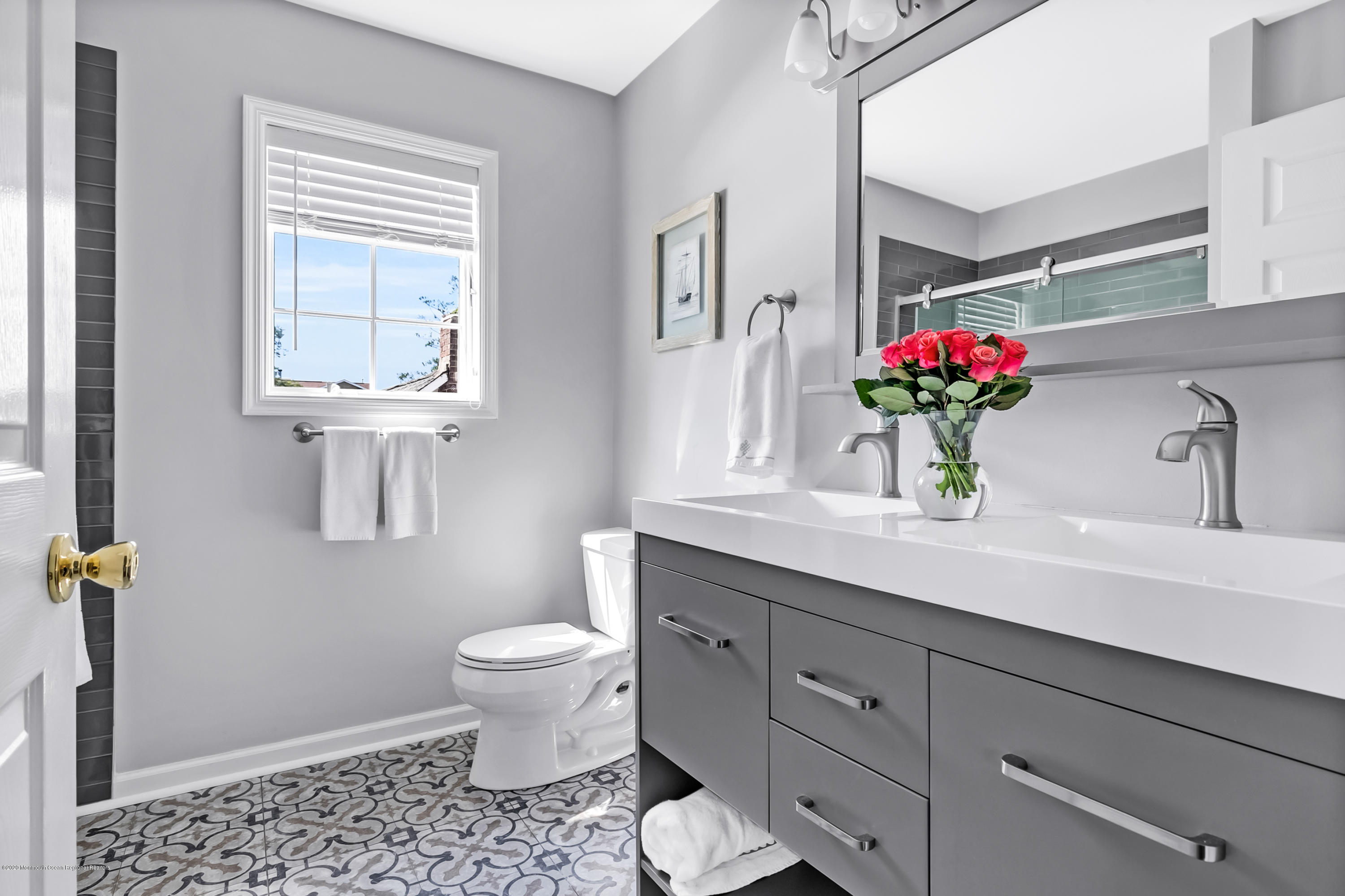 405 Salem Avenue, Unit SUMMER Spring Lake, NJ 07762 - Photo 21 of 46 a bathroom with a toilet sink and mirror