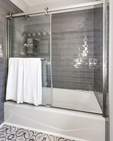 a bathroom with a shower and a bathtub