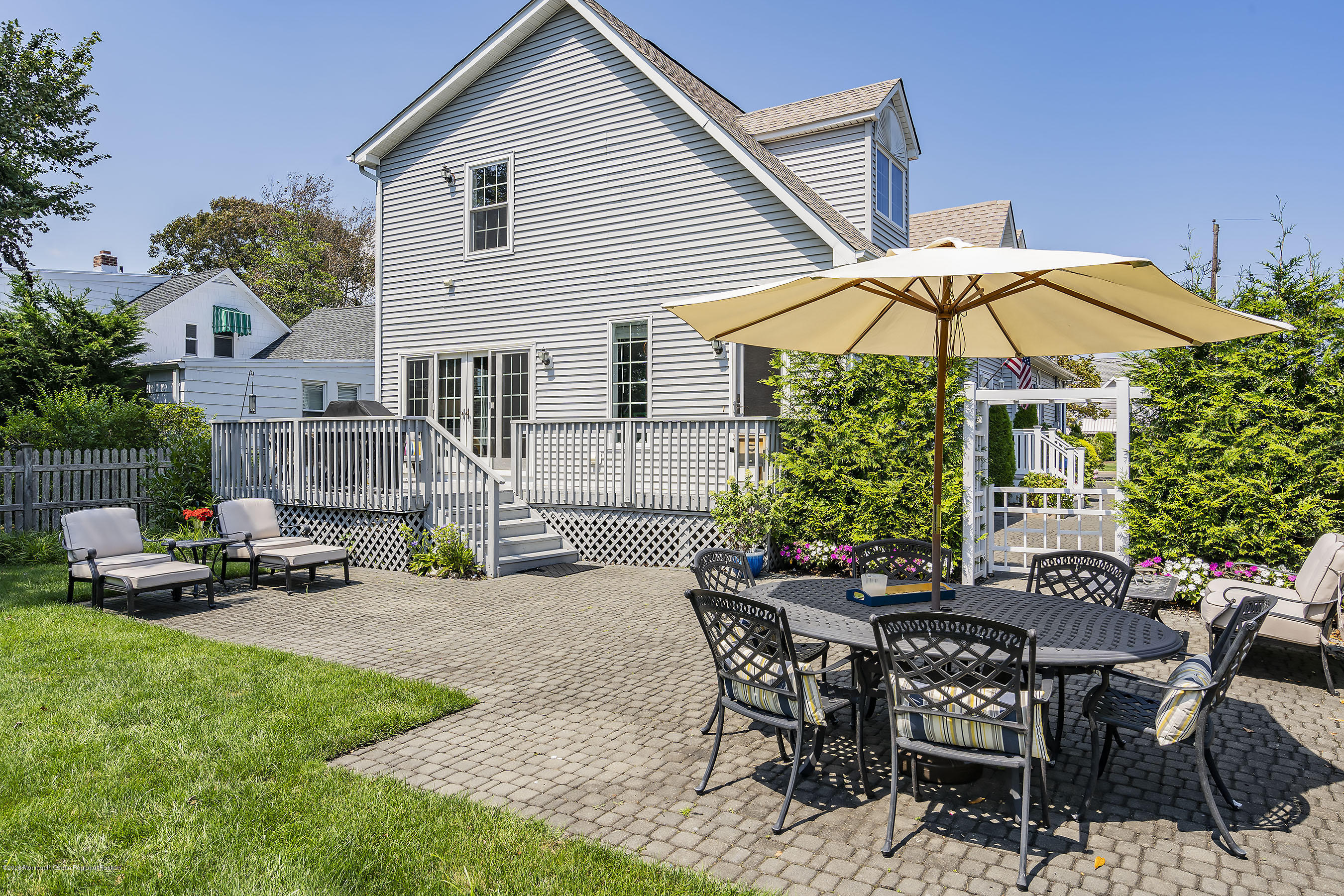 405 Salem Avenue, Unit SUMMER Spring Lake, NJ 07762 - Photo 36 of 46 a view of a house with backyard and sitting area