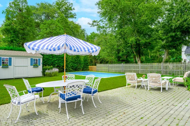 an outdoor space with furniture and umbrella