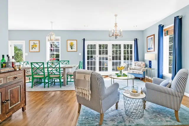 a living room with fireplace furniture and a wooden floor