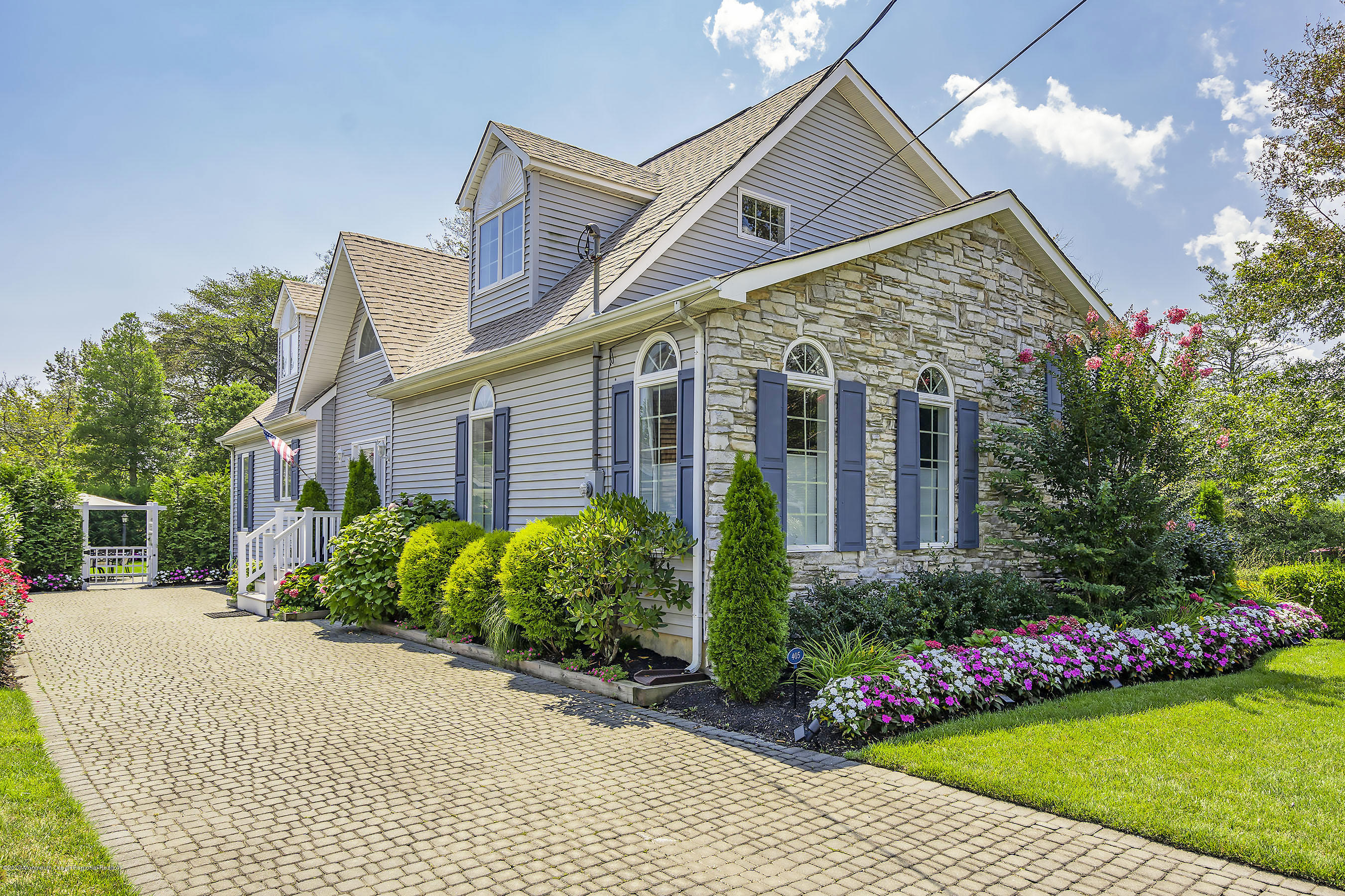 405 Salem Avenue, Unit SUMMER Spring Lake, NJ 07762 - Photo 45 of 46 a front view of house with a garden