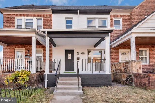 a view of a house with a chair and table and chairs