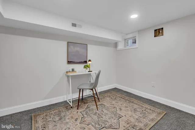 a workspace with furniture and wooden floor