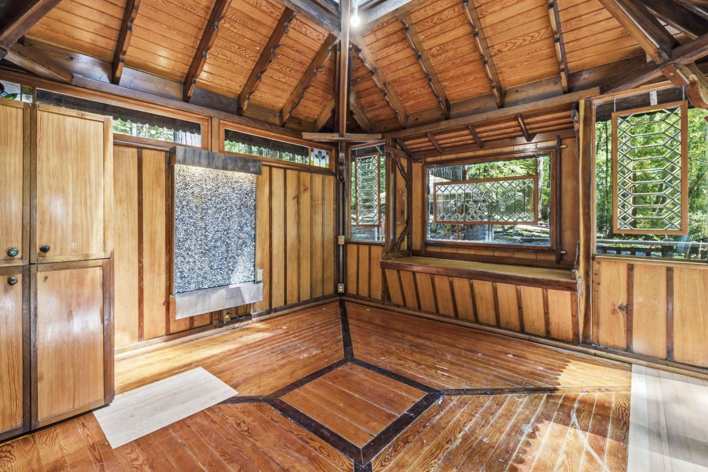 41 Back Road La Honda, CA 94020 - Photo 56 of 101 a view of an empty room with wooden floor and a window