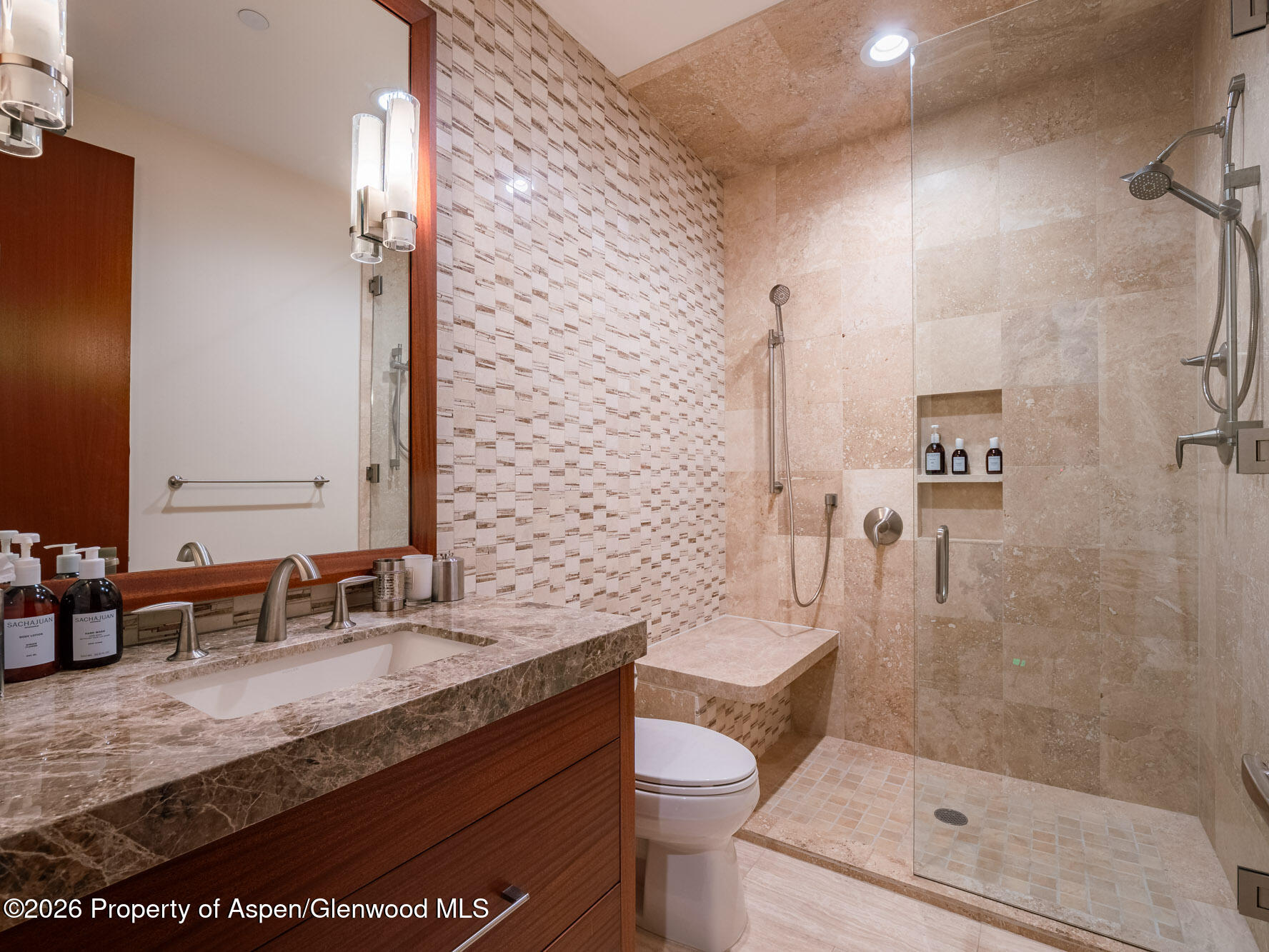 750 South Starwood Road Aspen, CO 81612 - Photo 17 of 39 a bathroom with a granite countertop sink a toilet and shower