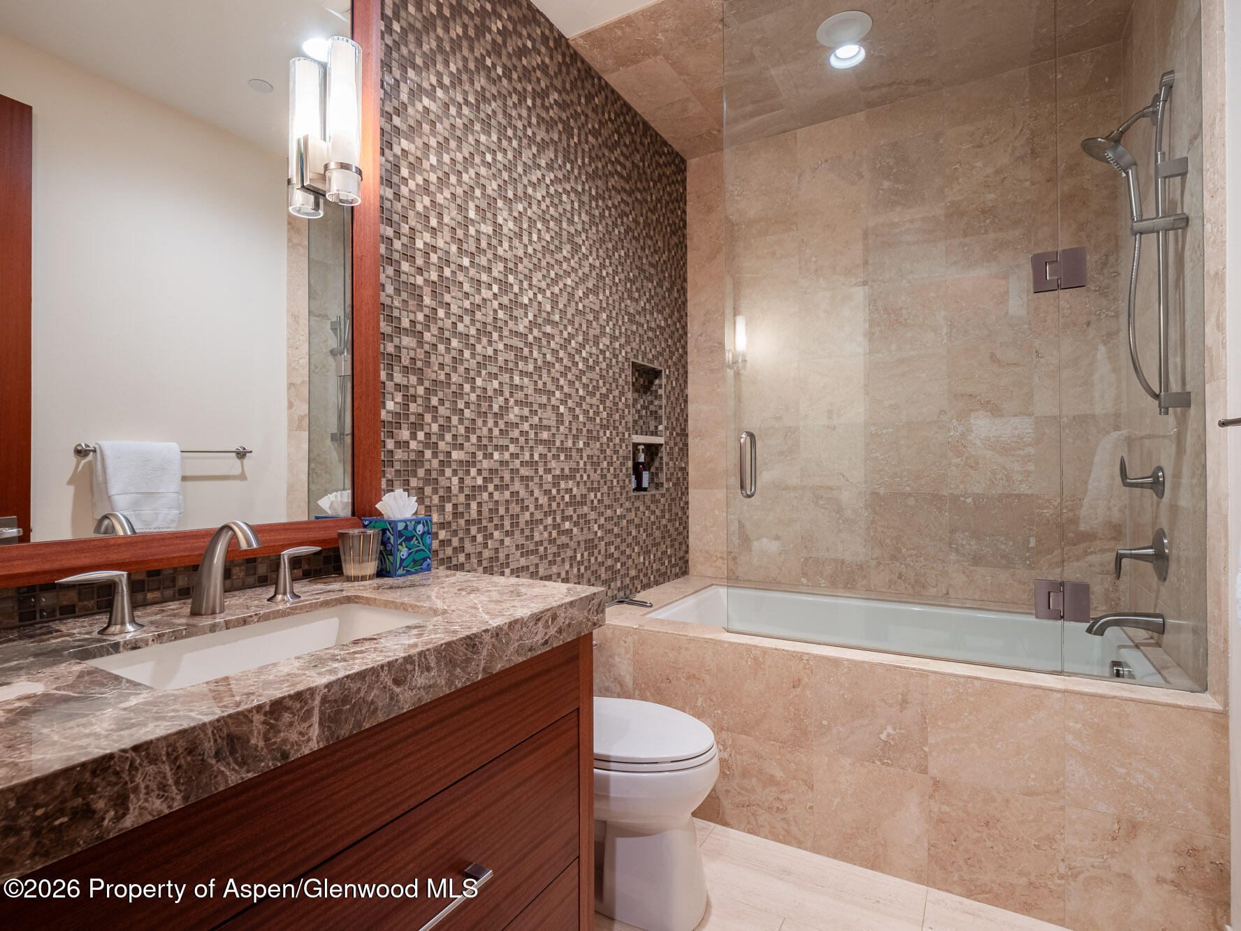 750 South Starwood Road Aspen, CO 81612 - Photo 25 of 39 a bathroom with a granite countertop sink a toilet a mirror and bathtub