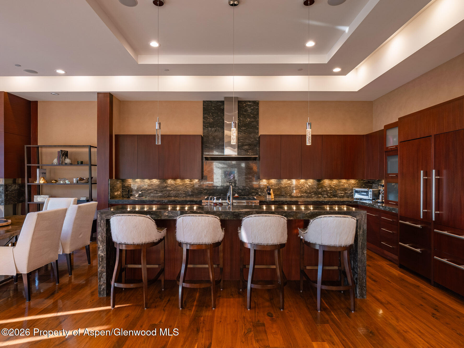 750 South Starwood Road Aspen, CO 81612 - Photo 8 of 39 a kitchen with a dining table chairs and view living room