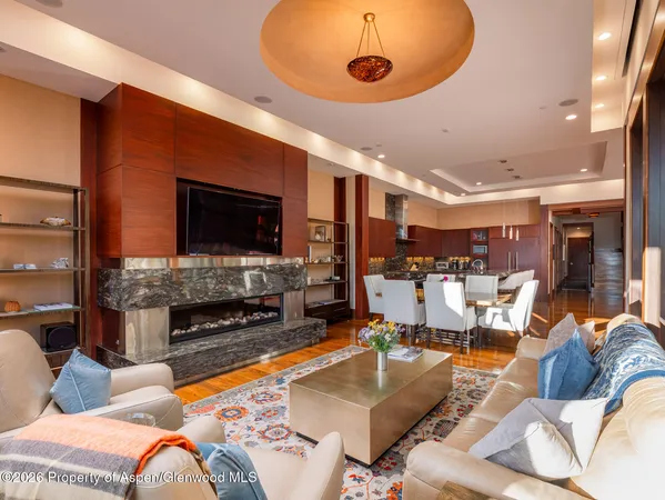 a living room with fireplace furniture and a flat screen tv