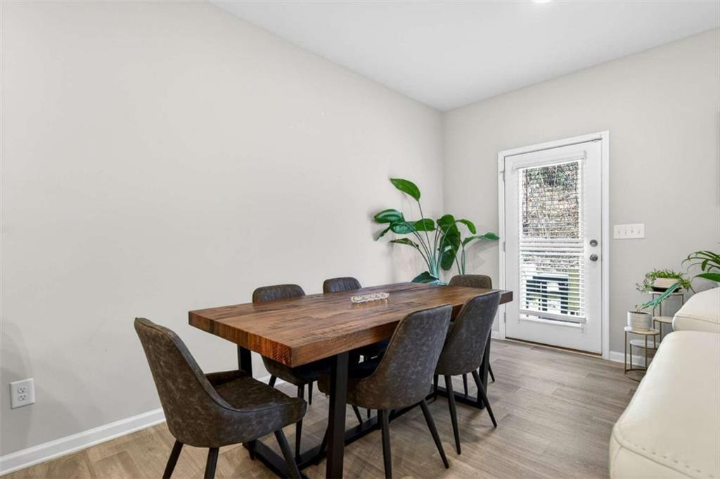 3182 Meadowstone Lane Southwest Atlanta, GA 30331 - Photo 14 of 32 a view of a dining room with furniture window and wooden floor