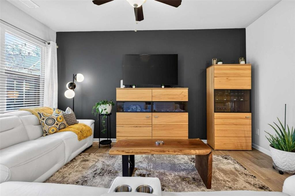 3182 Meadowstone Lane Southwest Atlanta, GA 30331 - Photo 15 of 32 a living room with furniture and a gate