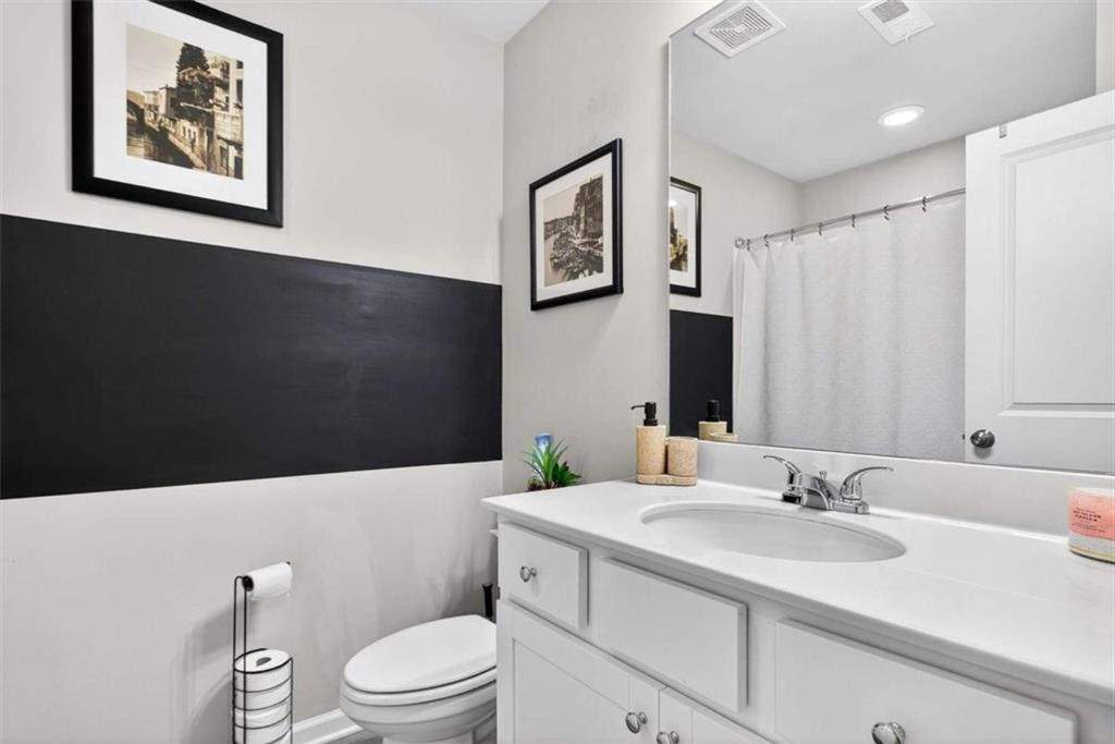 3182 Meadowstone Lane Southwest Atlanta, GA 30331 - Photo 25 of 32 a bathroom with a granite countertop sink mirror vanity and toilet