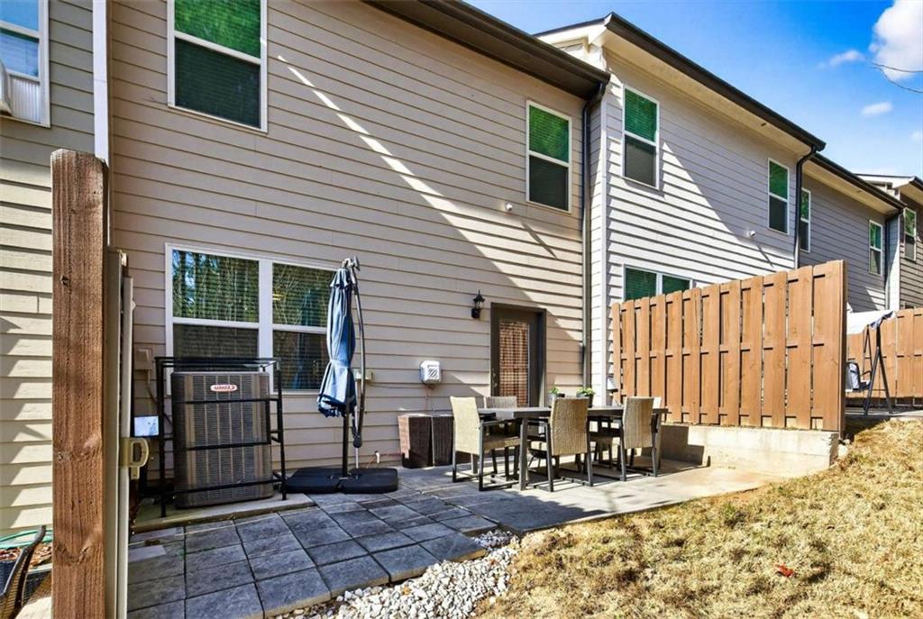 3182 Meadowstone Lane Southwest Atlanta, GA 30331 - Photo 27 of 32 a view of a house with a patio