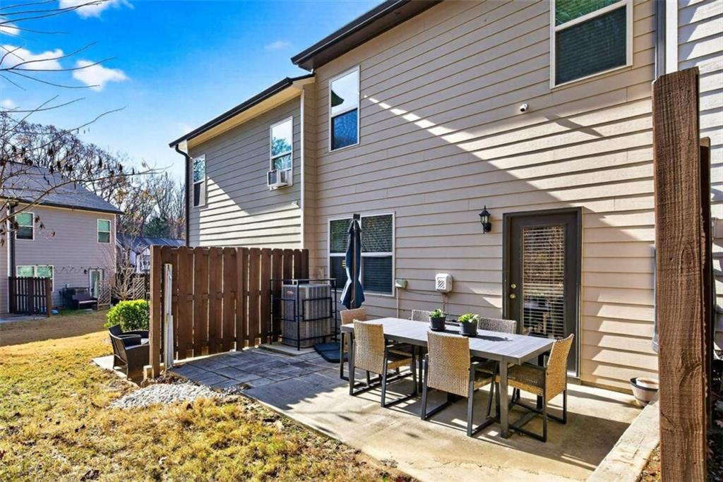 3182 Meadowstone Lane Southwest Atlanta, GA 30331 - Photo 28 of 32 a view of a dinning table and chairs in the patio