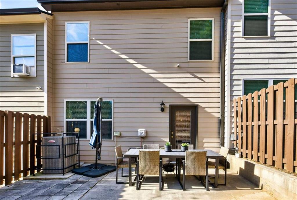 3182 Meadowstone Lane Southwest Atlanta, GA 30331 - Photo 29 of 32 a view of a dinning tables and chairs in a patio