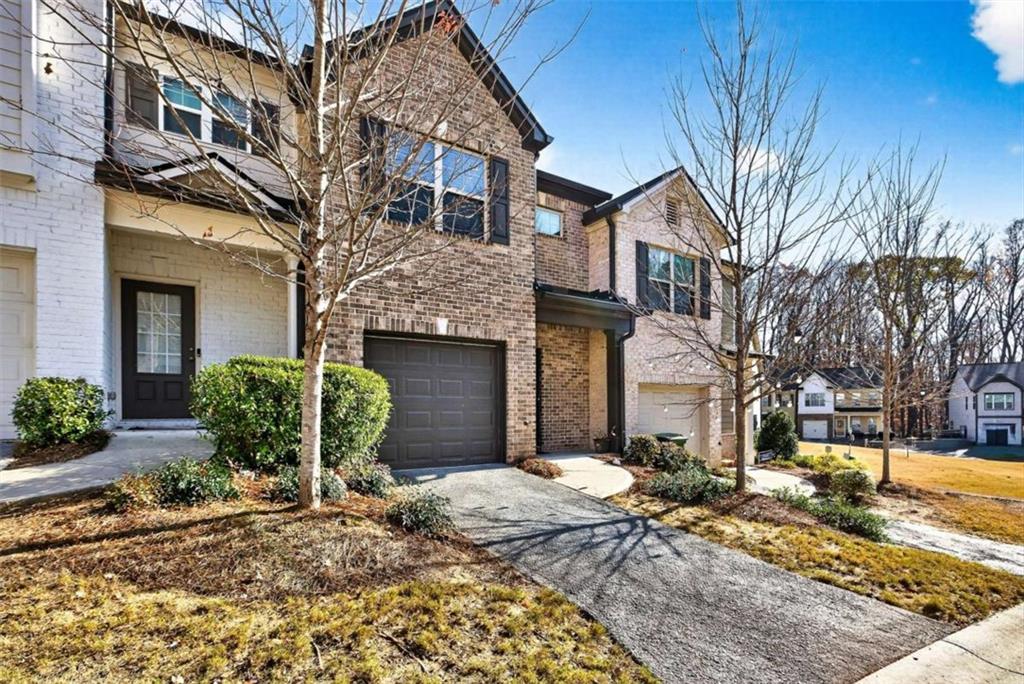 3182 Meadowstone Lane Southwest Atlanta, GA 30331 - Photo 3 of 32 a front view of a house with a yard