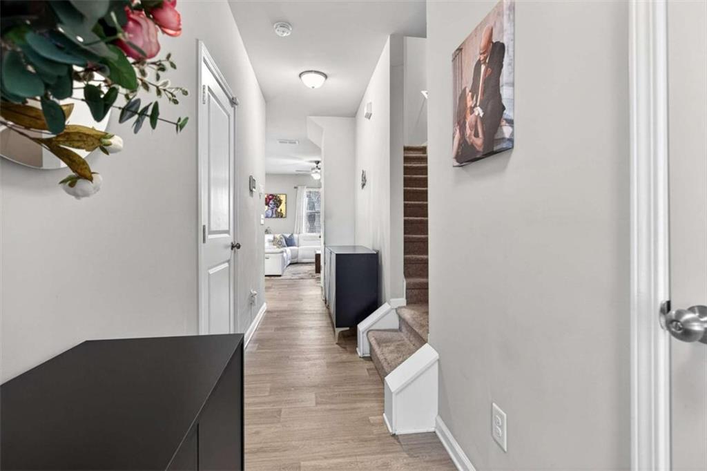 3182 Meadowstone Lane Southwest Atlanta, GA 30331 - Photo 6 of 32 a view of a hallway with wooden floor