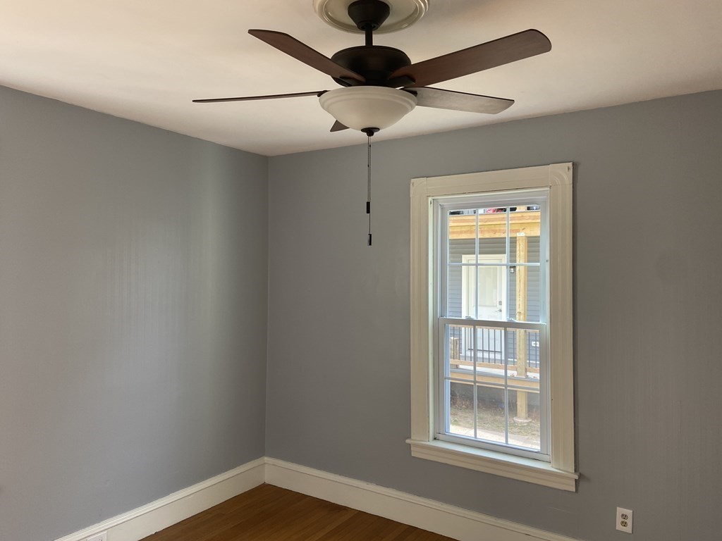 102-104 Allyn Street Holyoke, MA 01040 - Photo 14 of 26 a view of an empty room with a window
