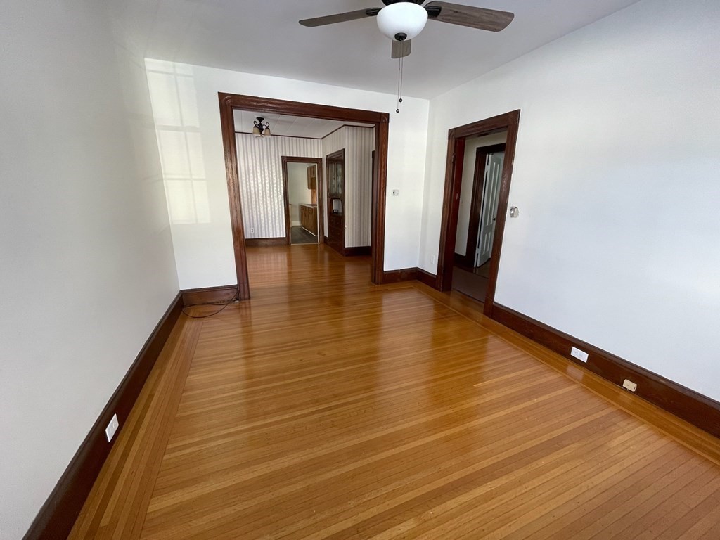 102-104 Allyn Street Holyoke, MA 01040 - Photo 16 of 26 a view of empty room with wooden floor