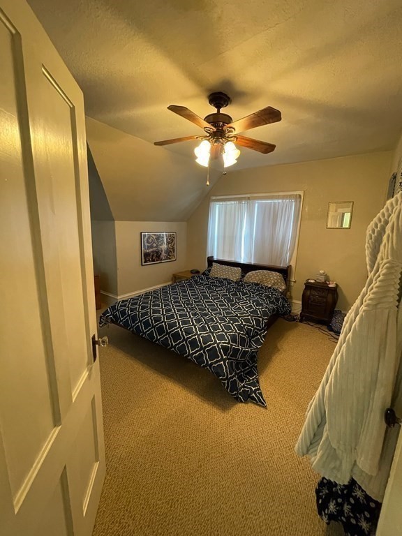 102-104 Allyn Street Holyoke, MA 01040 - Photo 20 of 26 a bedroom with a bed dresser and a window