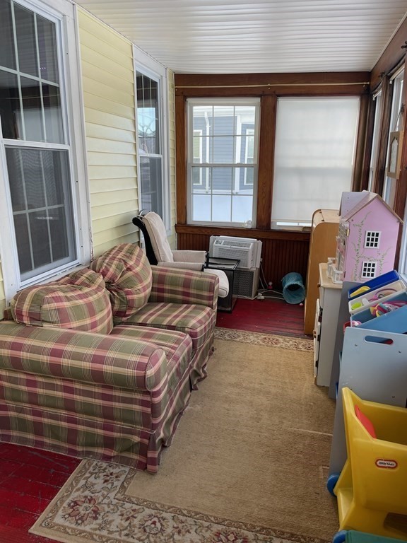 102-104 Allyn Street Holyoke, MA 01040 - Photo 24 of 26 a bedroom with a bed and wooden floor