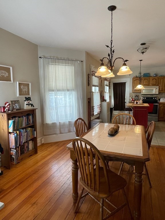 102-104 Allyn Street Holyoke, MA 01040 - Photo 3 of 26 a view of a a dining room with furniture window and wooden floor