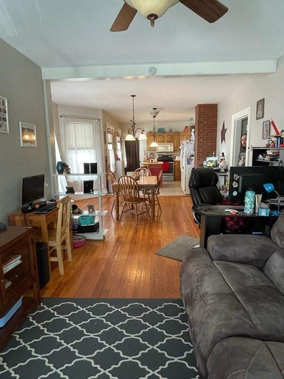 102-104 Allyn Street Holyoke, MA 01040 - Photo 5 of 26 a living room with furniture and a flat screen tv