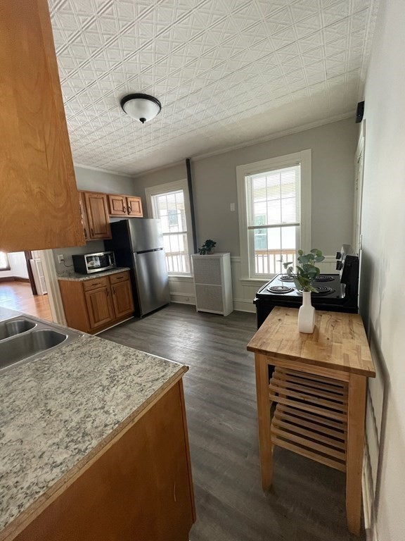 102-104 Allyn Street Holyoke, MA 01040 - Photo 6 of 26 a kitchen with sink refrigerator and window