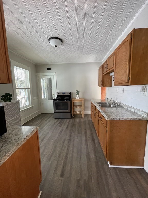 102-104 Allyn Street Holyoke, MA 01040 - Photo 8 of 26 a view of kitchen with sink microwave and refrigerator