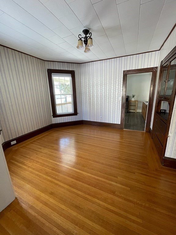 102-104 Allyn Street Holyoke, MA 01040 - Photo 10 of 26 an empty room with wooden floor and windows