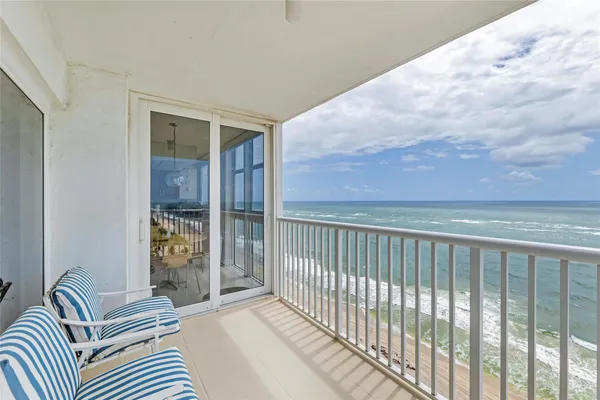 a view of a balcony with furniture