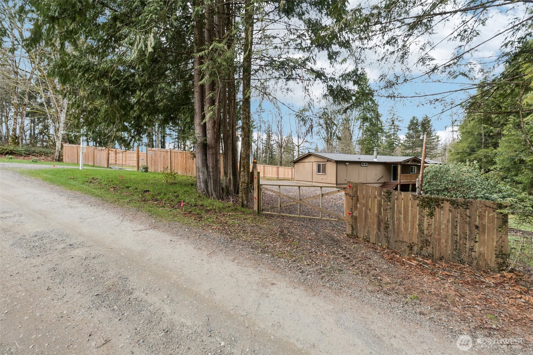 34408 Northeast 111th Street Carnation, WA 98014 - Photo 4 of 34 a view of backyard with large trees and wooden fence