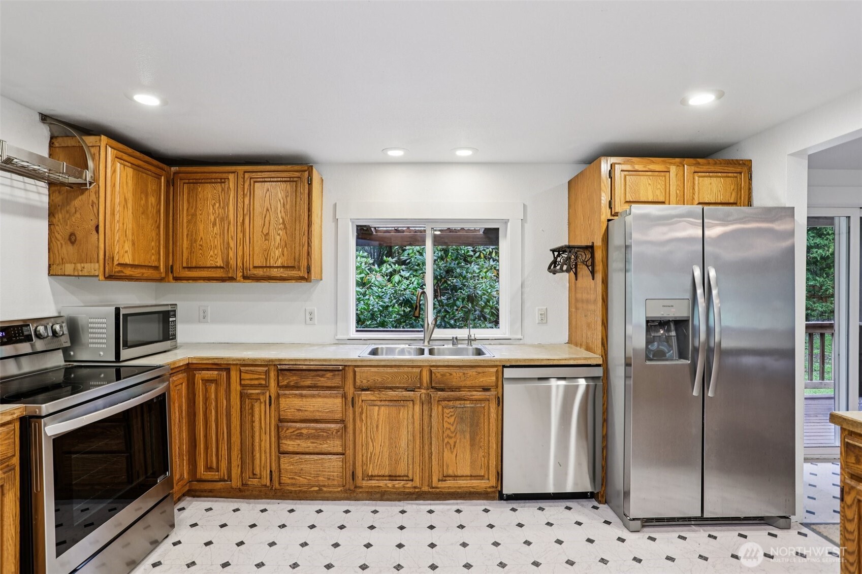 34408 Northeast 111th Street Carnation, WA 98014 - Photo 5 of 34 a kitchen with stainless steel appliances a refrigerator sink and microwave