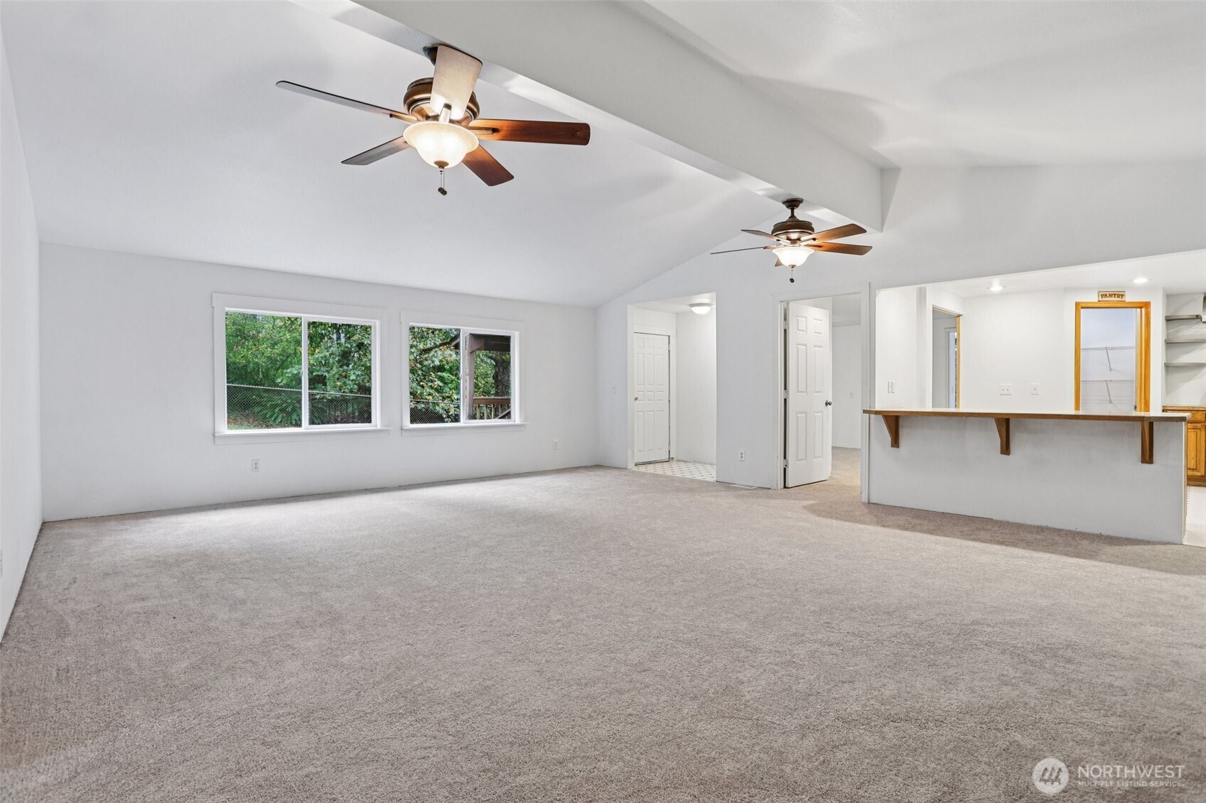 34408 Northeast 111th Street Carnation, WA 98014 - Photo 10 of 34 a view of a livingroom with a ceiling fan and window
