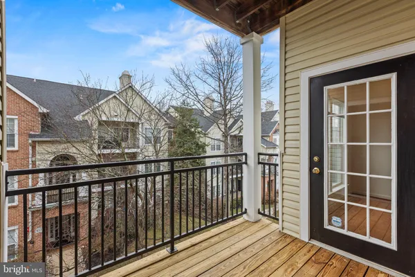 a view of a houses from a balcony