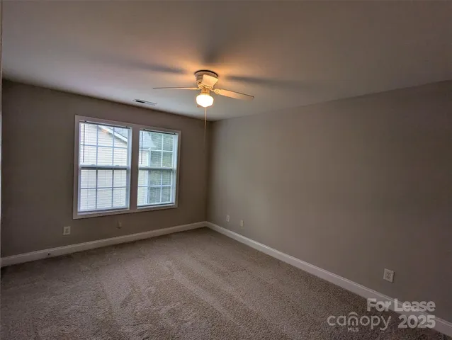 a view of empty room with windows