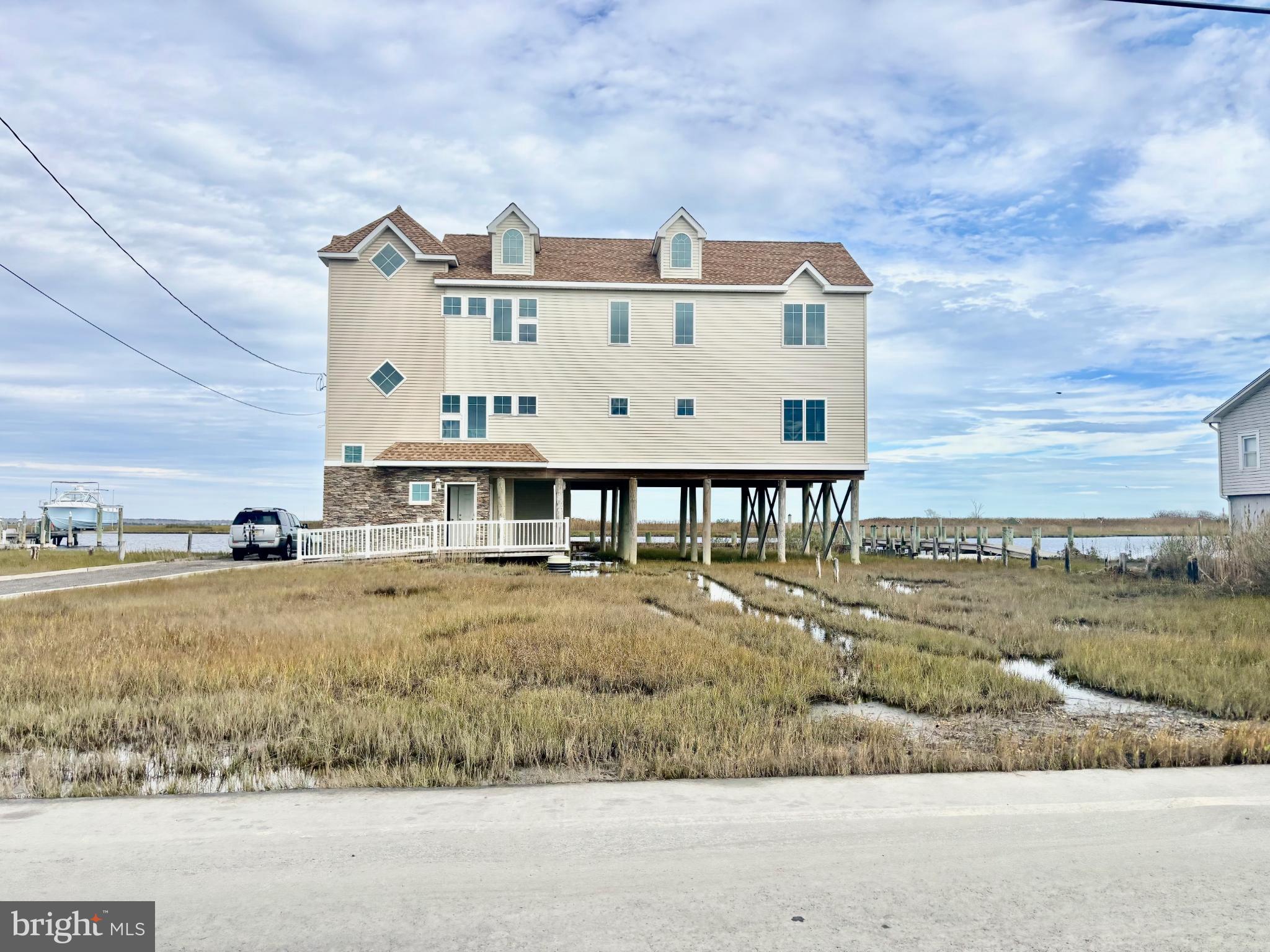 a large building with a big yard and large trees