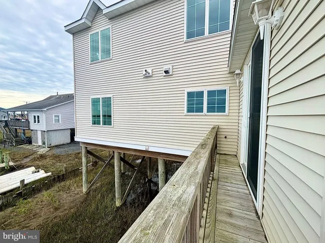 a balcony view with a seating space
