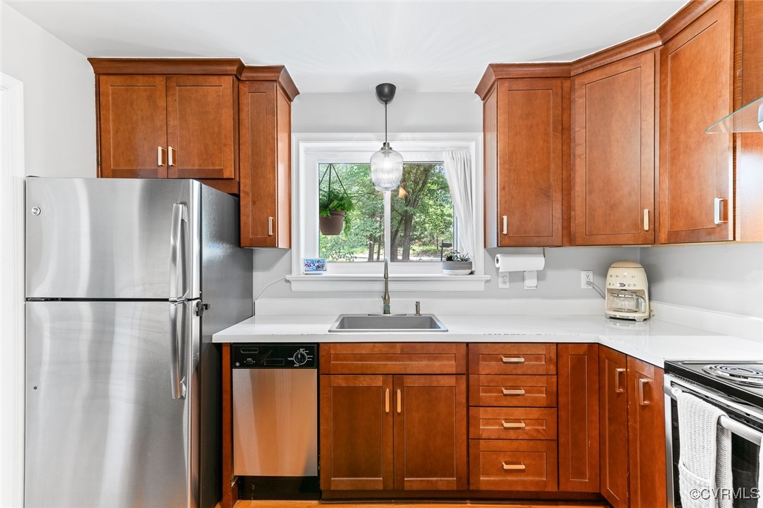 7735 Cherokee Road Richmond, VA 23225 - Photo 13 of 33 a kitchen with stainless steel appliances granite countertop a refrigerator sink and cabinets