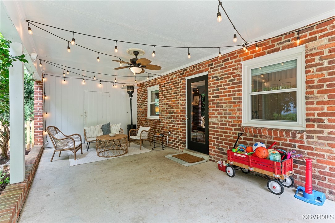 7735 Cherokee Road Richmond, VA 23225 - Photo 28 of 33 a backyard of a house with dining table and chairs
