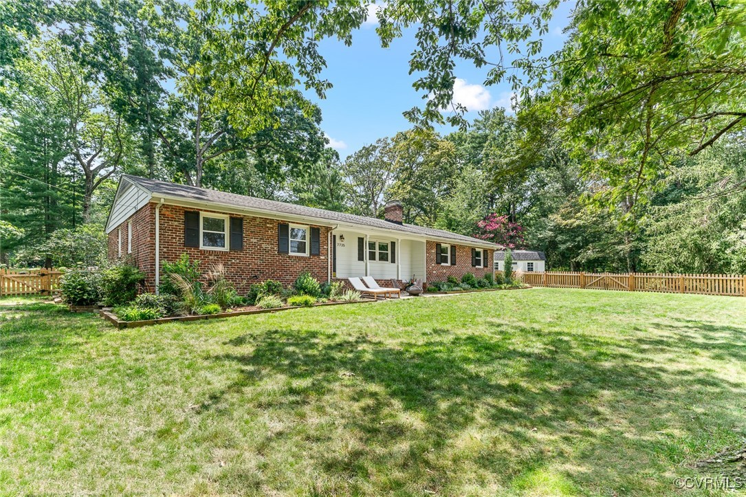 7735 Cherokee Road Richmond, VA 23225 - Photo 3 of 33 a house view with a garden space