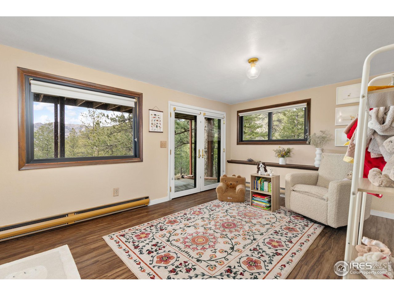 661 Peakview Road Boulder, CO 80302 - Photo 20 of 39 Lower level sitting room/second living room with access to outside hot tub and sauna