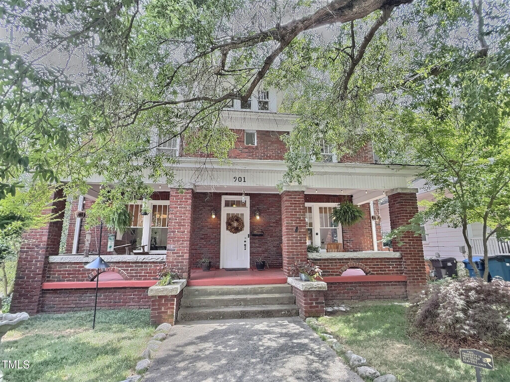 901 West Markham Avenue Durham, NC 27701 - Photo 1 of 38 a front view of a house with a yard