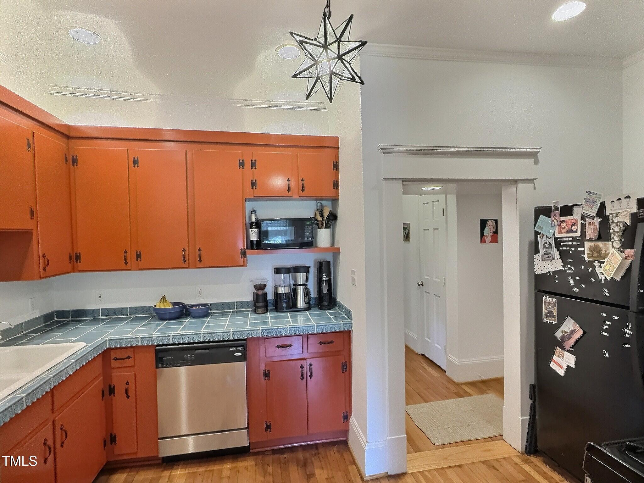 901 West Markham Avenue Durham, NC 27701 - Photo 15 of 38 a kitchen with stainless steel appliances granite countertop a refrigerator and a sink