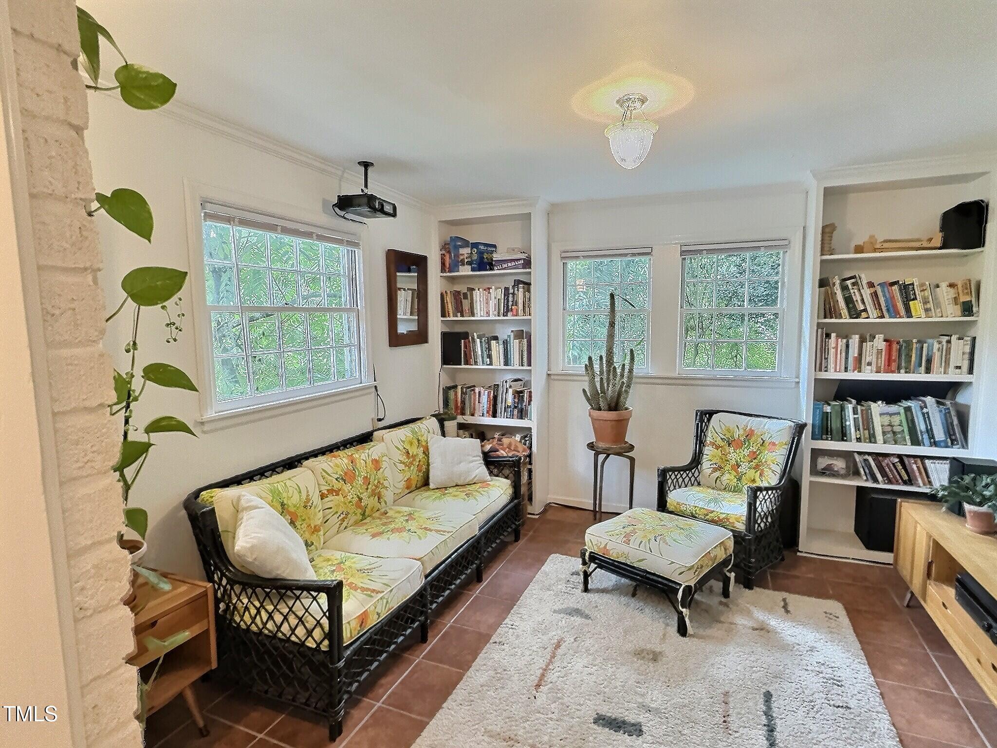 901 West Markham Avenue Durham, NC 27701 - Photo 18 of 38 a living room with furniture and a book shelf