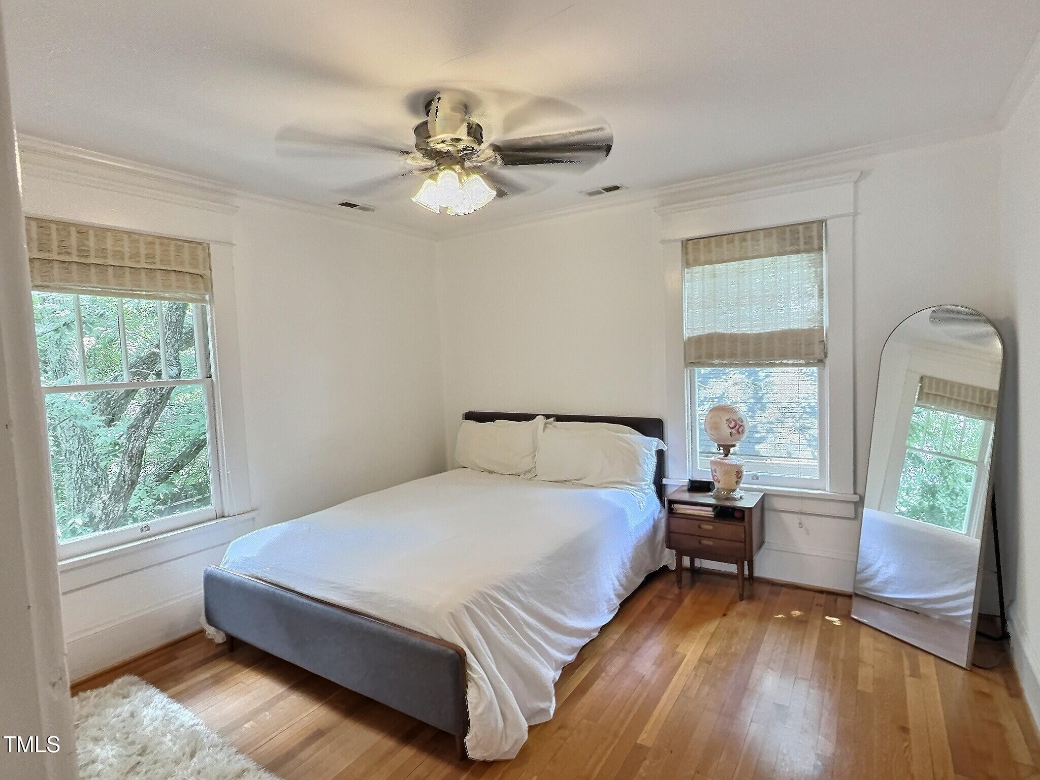 901 West Markham Avenue Durham, NC 27701 - Photo 29 of 38 a bedroom with a large bed and a large window