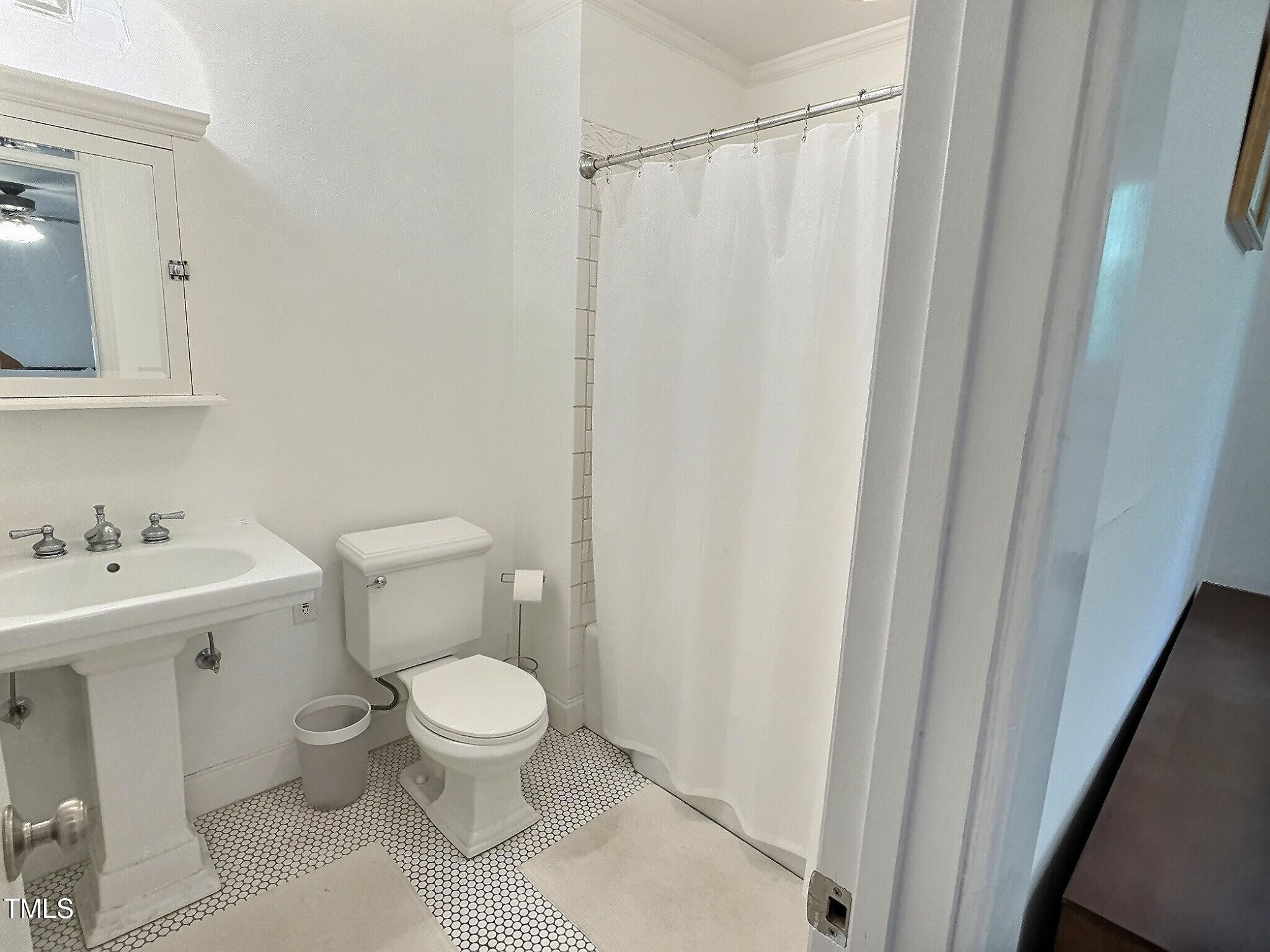 901 West Markham Avenue Durham, NC 27701 - Photo 30 of 38 a white toilet sitting next to a bathroom sink