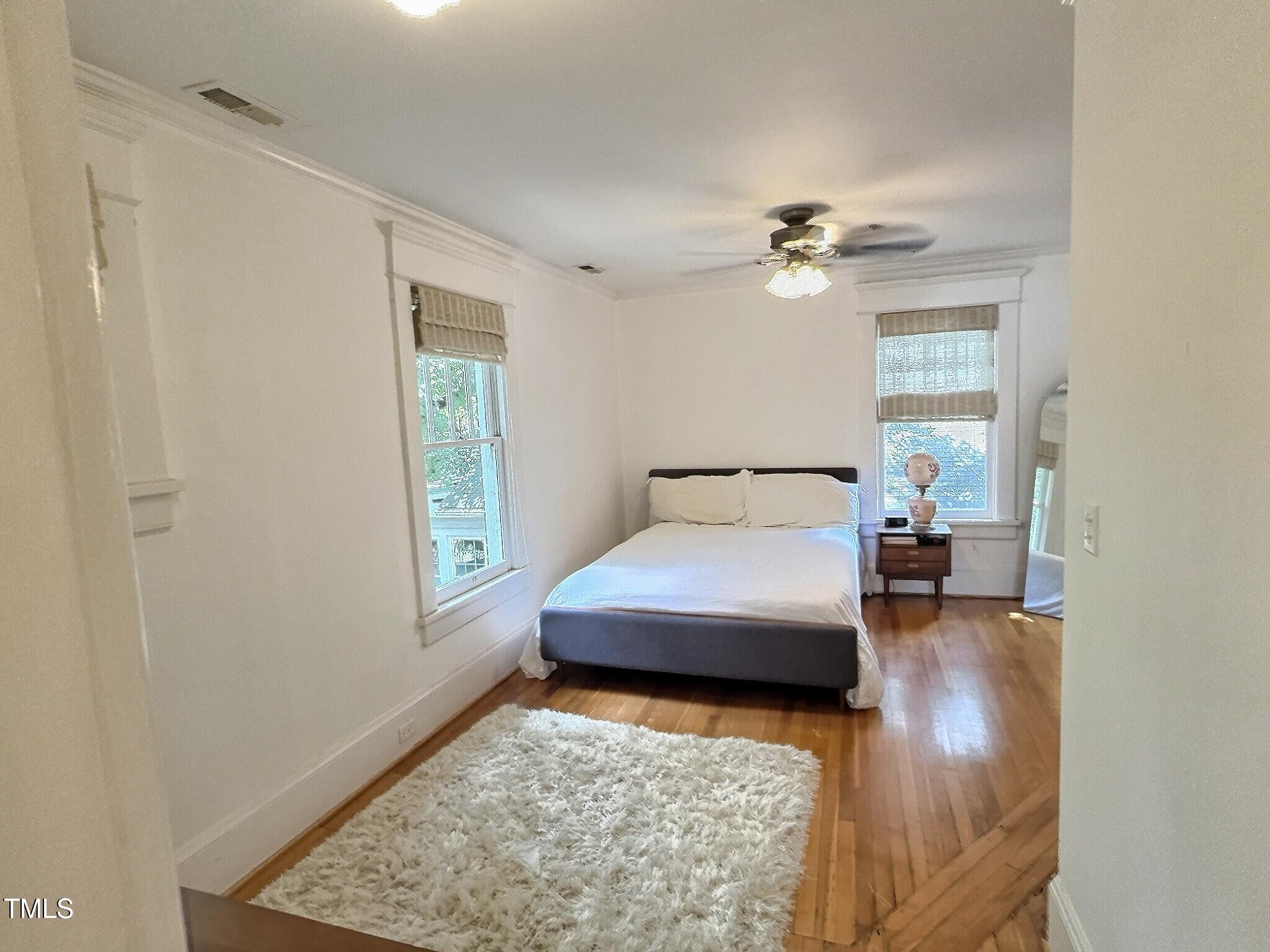 901 West Markham Avenue Durham, NC 27701 - Photo 31 of 38 a bedroom with a bed and window